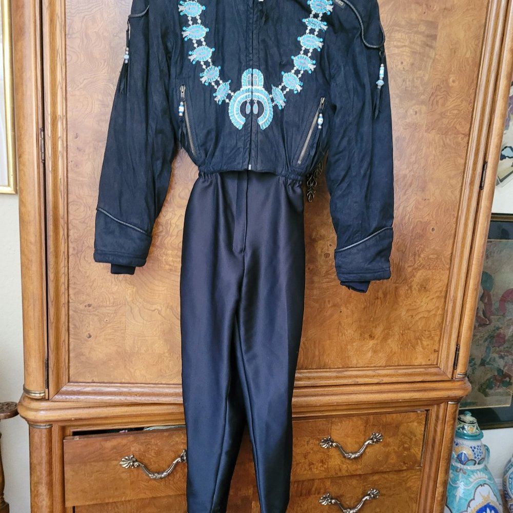 Skea ski suit , onepiece, black with embroidery, size 10